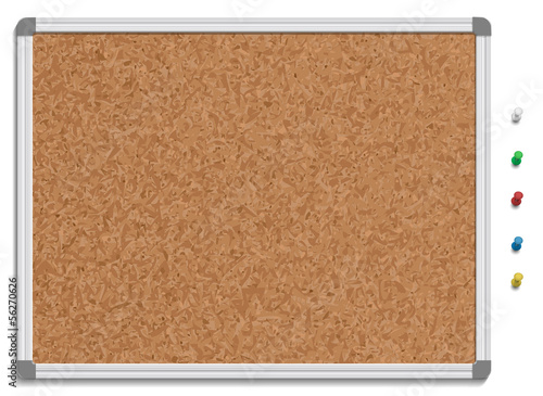 Empty corkboard with colored pins photo