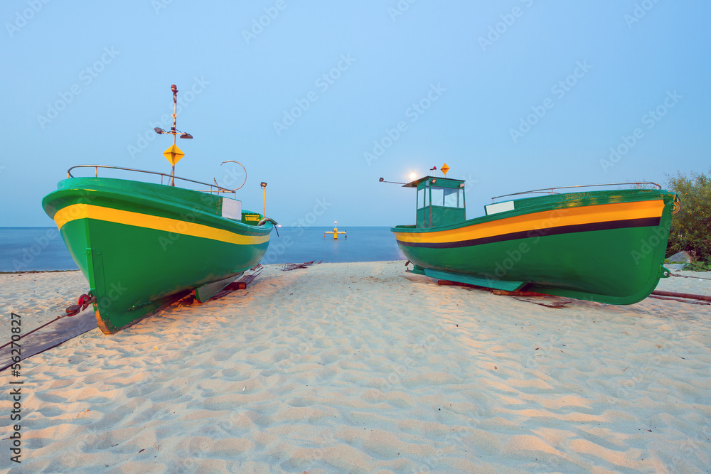 Green fishing boats on the beach of Baltic sea, Poland Green fishing boats on the beach of Baltic sea, Poland