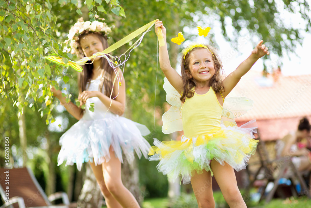 Fototapeta premium Two cute young sisters as the ballet dancers