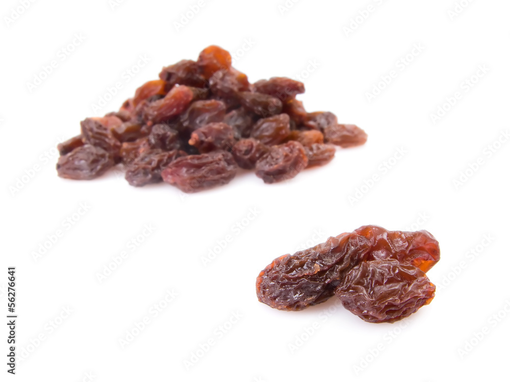 Pile of raisins isolated on white background. Pile of raisins isolated on white background.