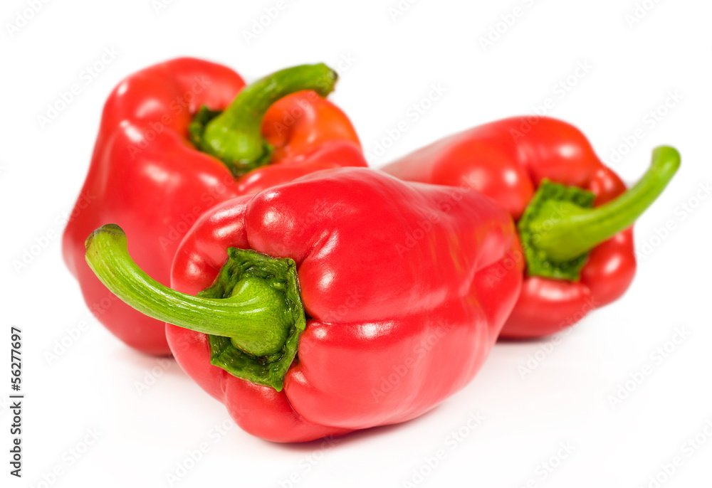 group of three red peppers