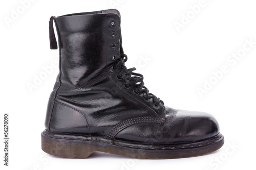 Old black leather work boots isolated on white background