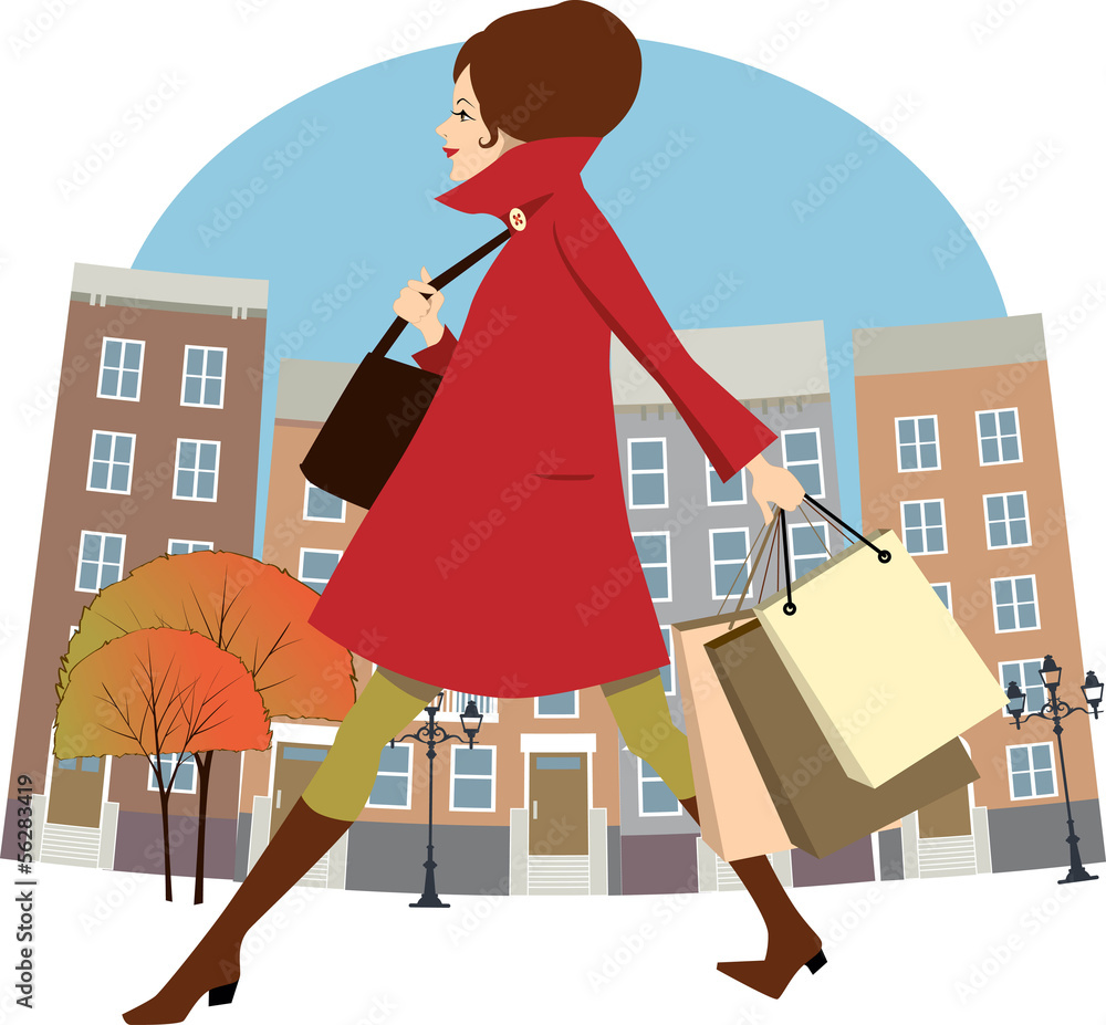 Woman going shopping in the autumn city