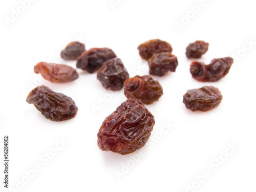 Twelve raisins for New Year wish isolated on white.