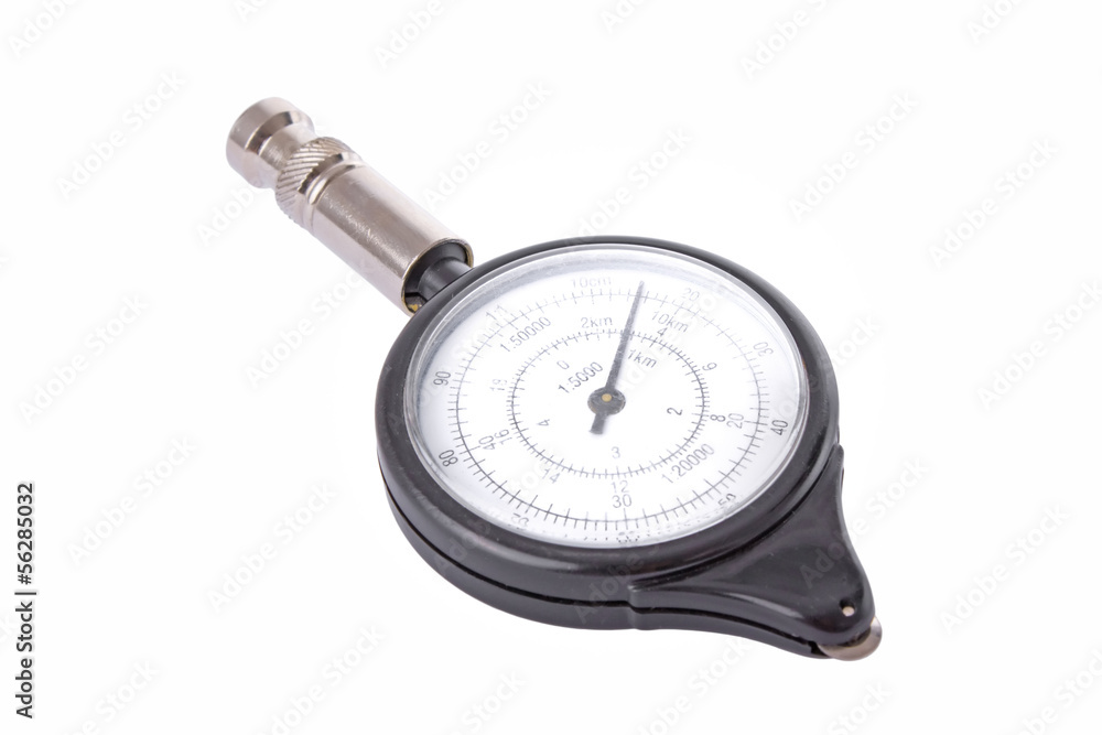 Analogue map measurer isolated on a white background. Analogue map measurer isolated on a white background.