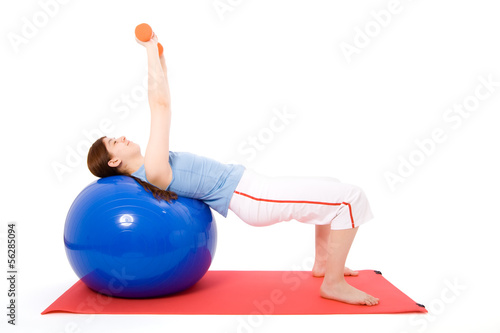 Young woman performing fitness exercises