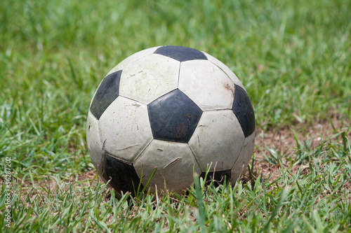 Old Soccer ball on grass