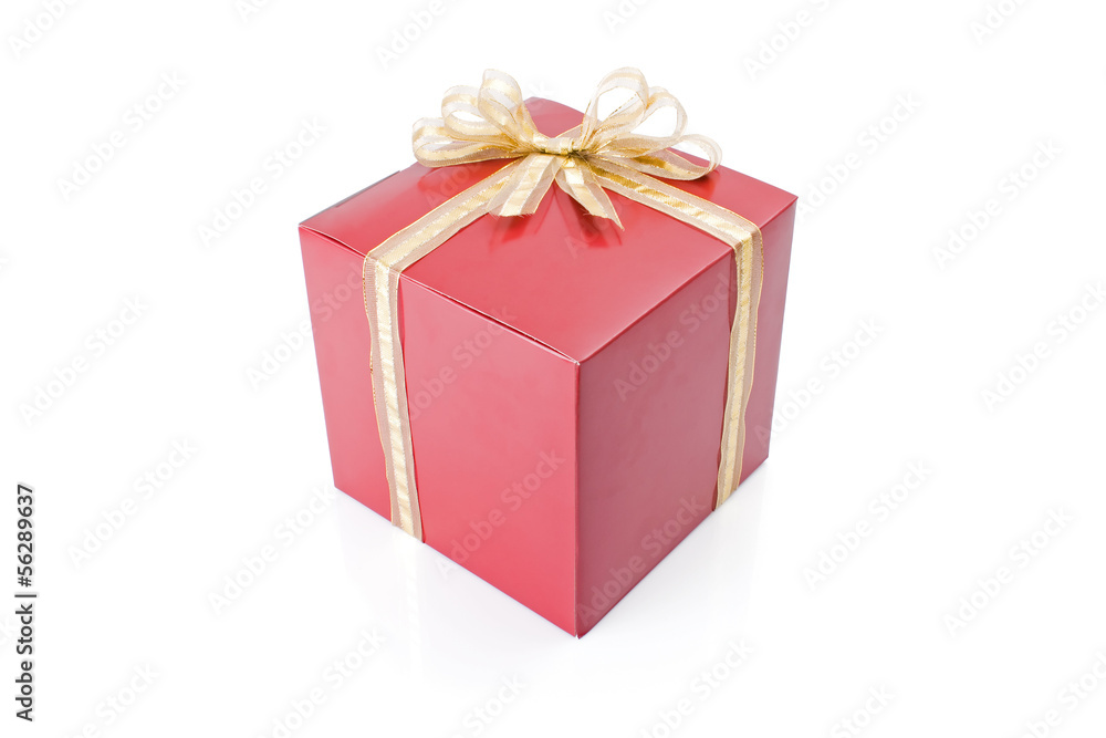 Red gift with a golden bow isolated on white background. Red gift with a golden bow isolated on white background.