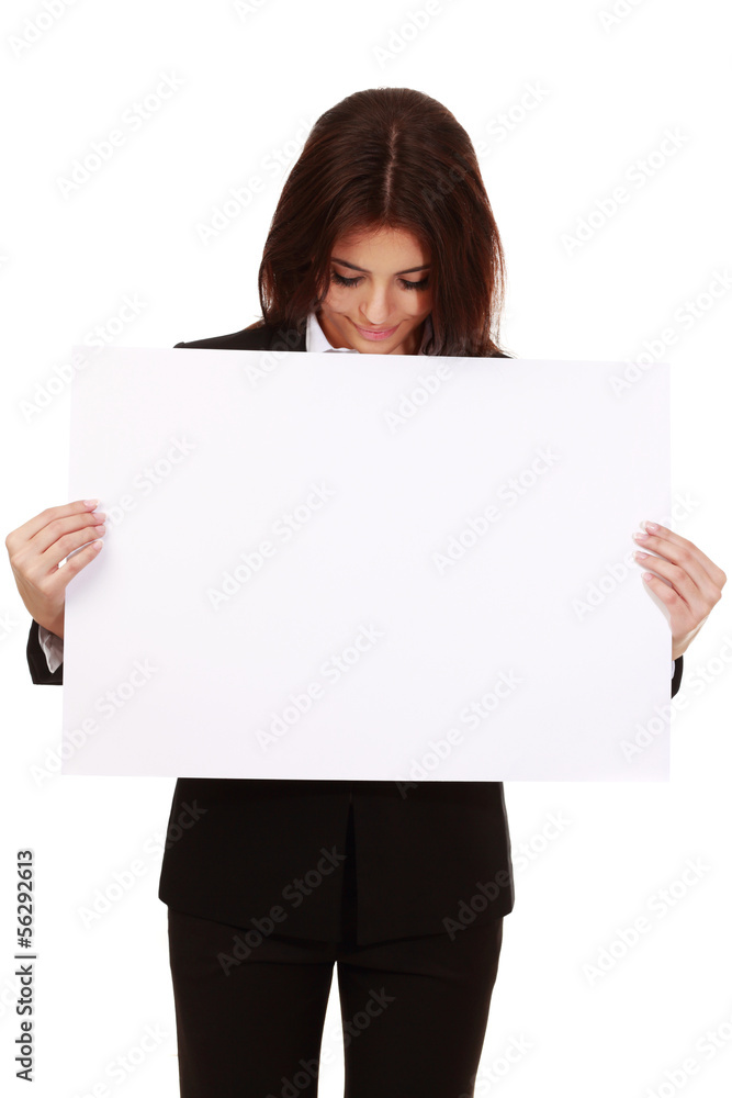 Businesswoman holding a banner and looking at camera Businesswoman holding a banner and looking at camera