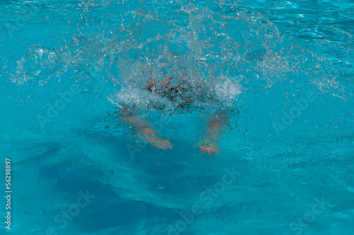 Swimmer  in swiming pool . © LarisaP