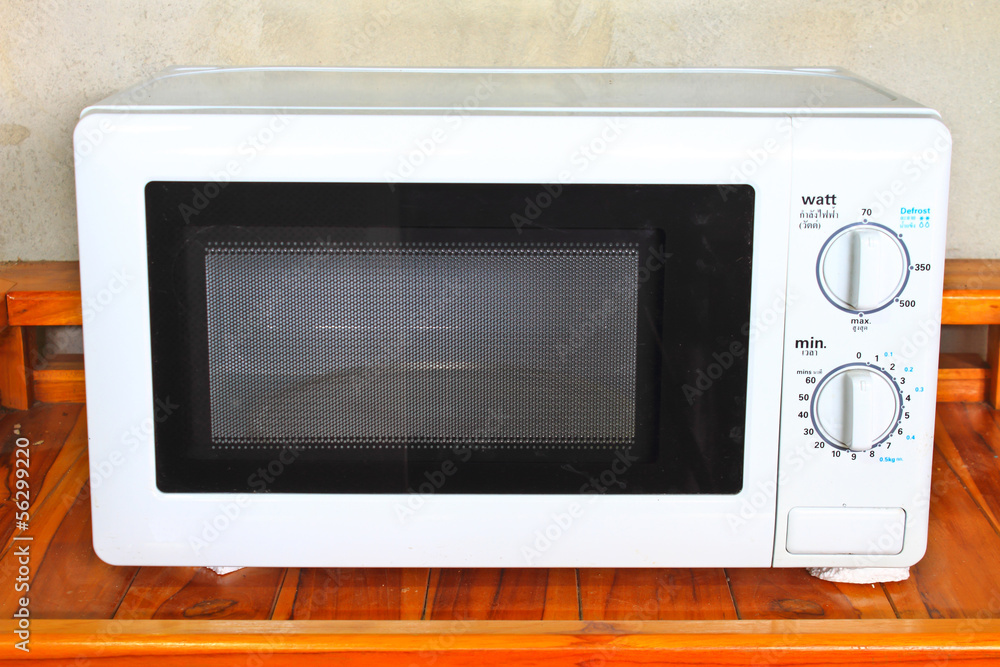 Fototapeta premium Microwave oven on the table