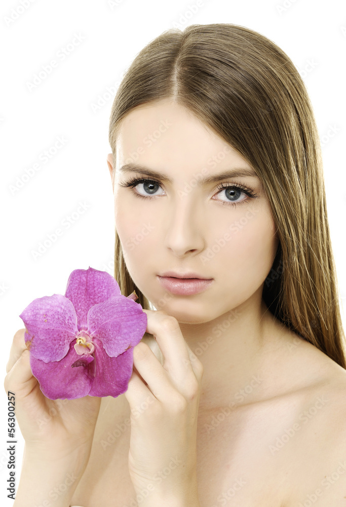 Close up young beautiful woman with pink orchid Close up young beautiful woman with pink orchid