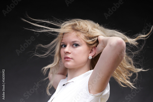 Blonde woman with her hair blowing