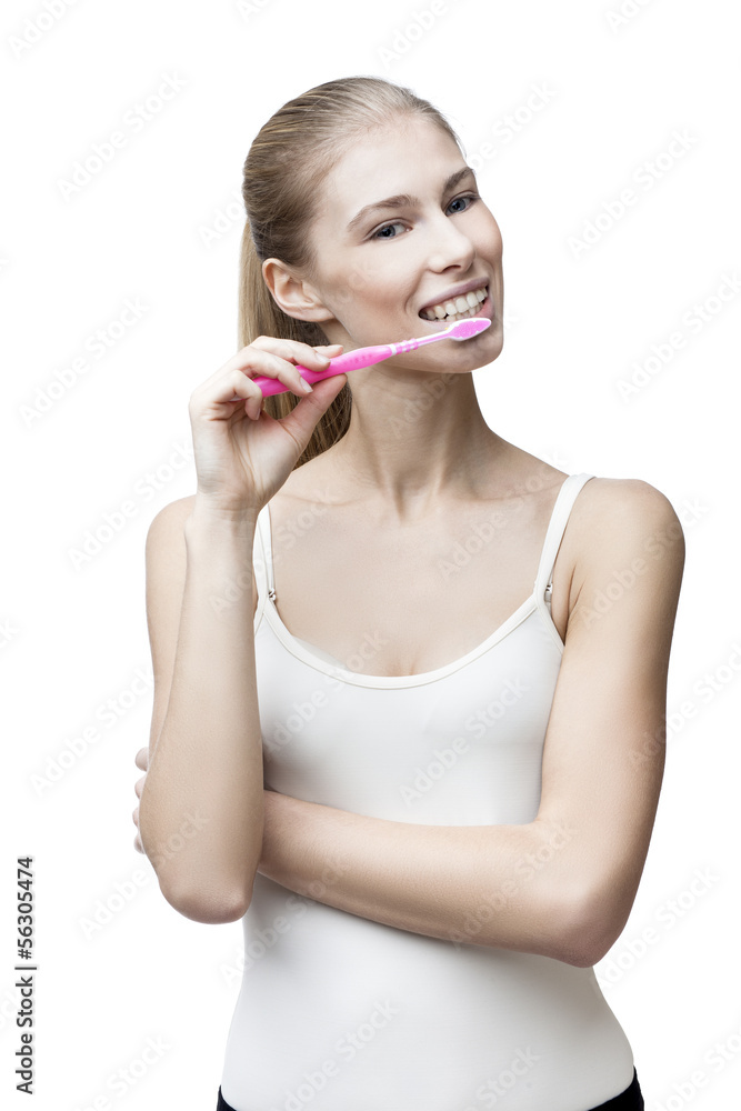 happy young blond woman with toothbrush happy young blond woman with toothbrush