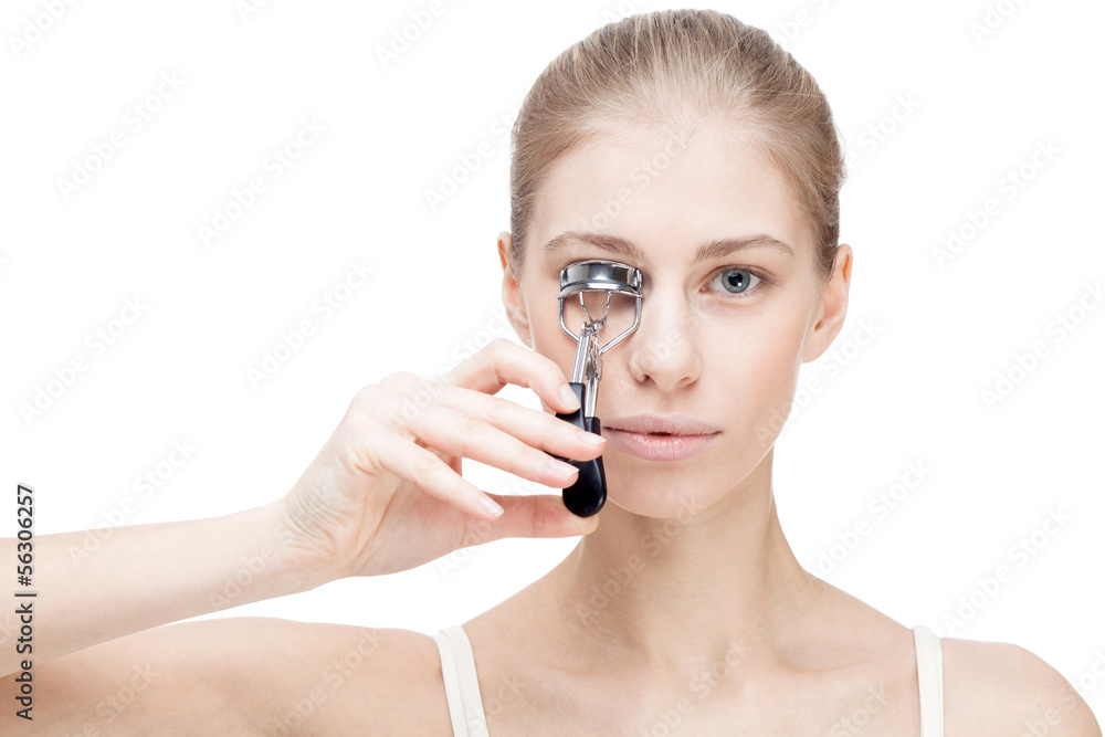 young blond woman holding curler isolated on white young blond woman holding curler isolated on white