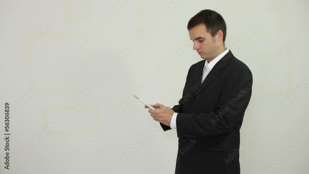 Businessman texting message on digital tablet Businessman texting message on digital tablet