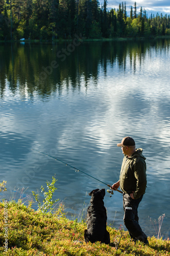 Fisherman and dog