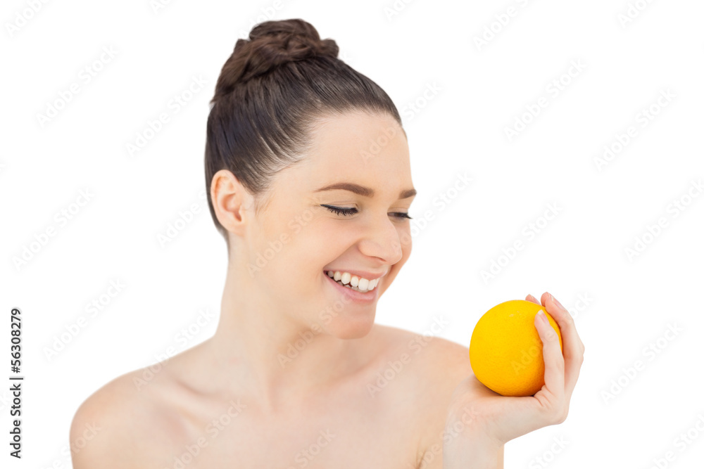 Happy pretty model holding orange Happy pretty model holding orange