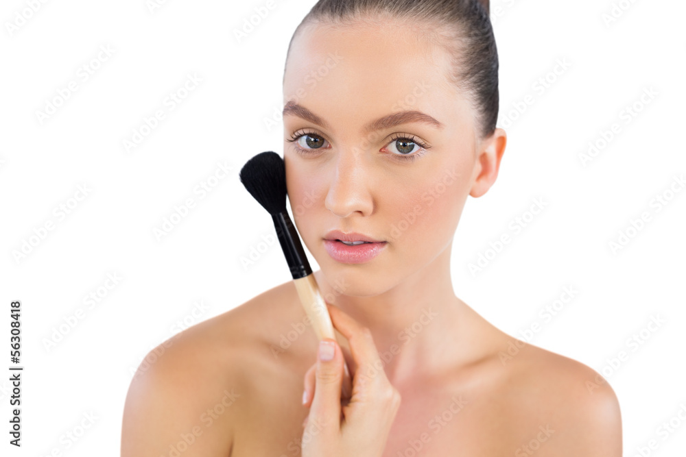 Attractive young model with powder brush Attractive young model with powder brush