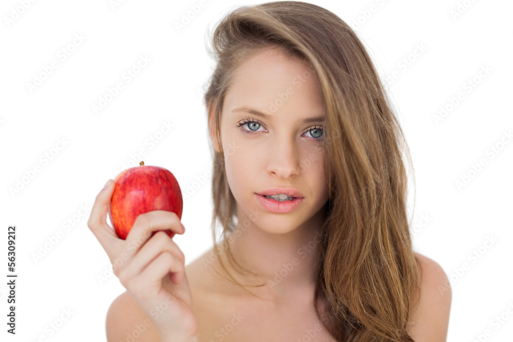 Attractive brunette model holding an apple Attractive brunette model holding an apple