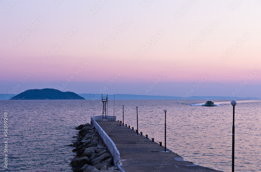 Pier and turtle island in a background, near Neos Marmaros