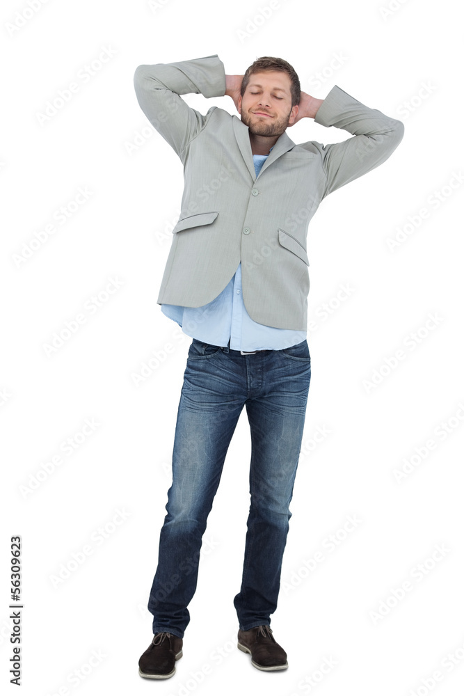 Suave man in a blazer with hands behind head Suave man in a blazer with hands behind head