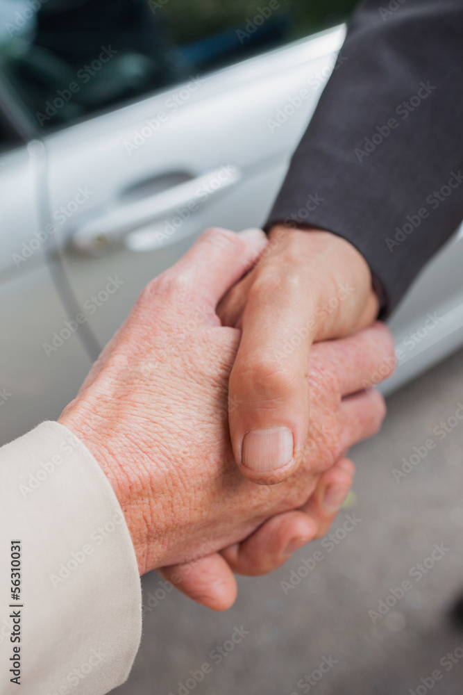 Close up on business people shaking hands