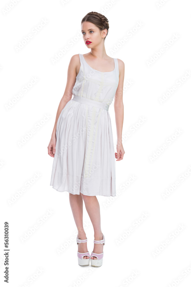 Beautiful woman in white dress posing
