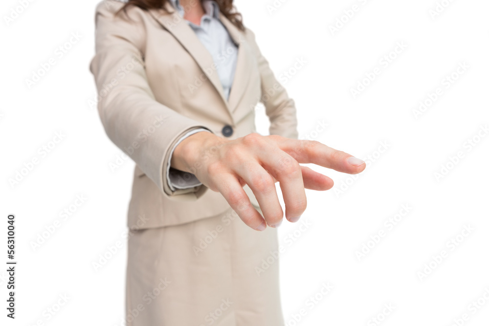 Stylish businesswoman touching invisible screen Stylish businesswoman touching invisible screen
