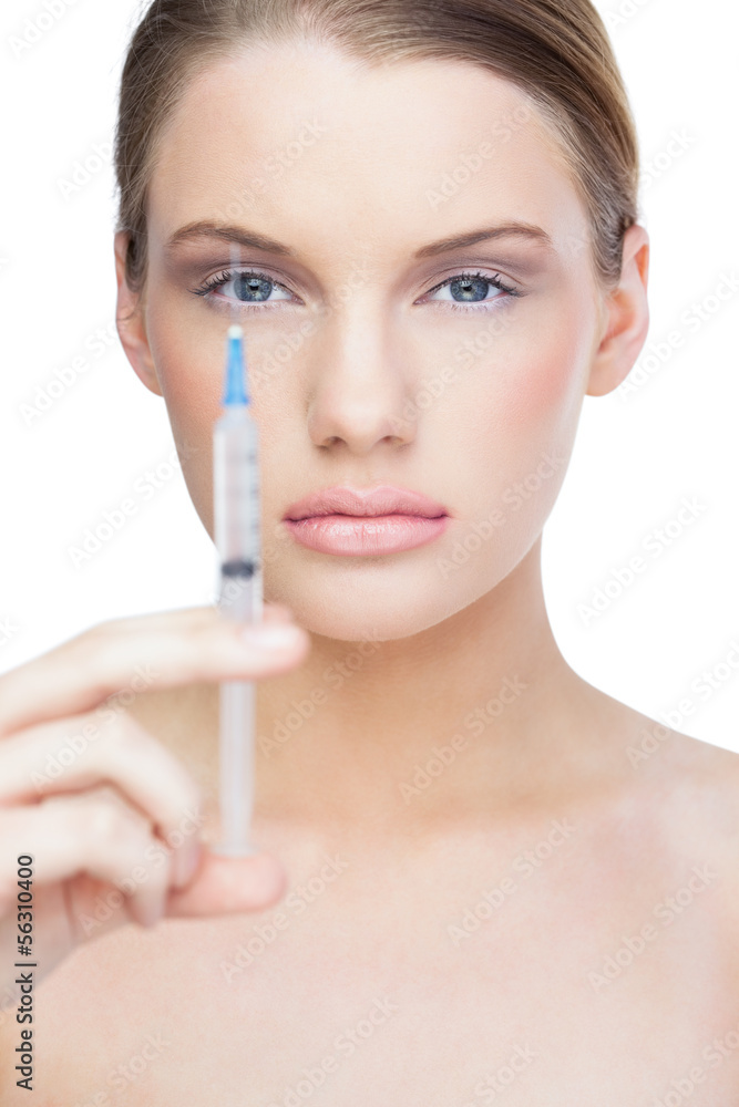 Calm pretty model holding surgical needle Calm pretty model holding surgical needle
