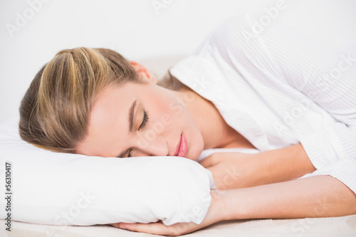 Cute model sleeping in cosy bed