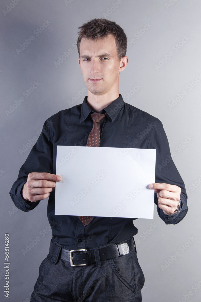 young handsome businessman with blank card young handsome businessman with blank card
