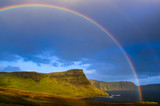 Rainbow over dramatic coast of Scottish highlands, Isle of Skye
