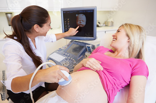 Pregnant Woman Having 4D Ultrasound Scan photo