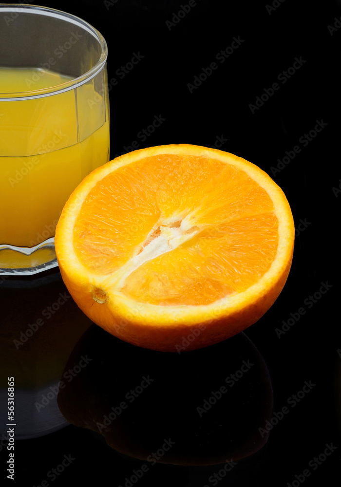 orange juice with a slice of orange on a black background orange juice with a slice of orange on a black background