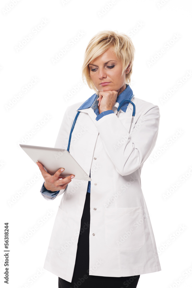 Blonde female doctor contemplating from patient's result Blonde female doctor contemplating from patient's result