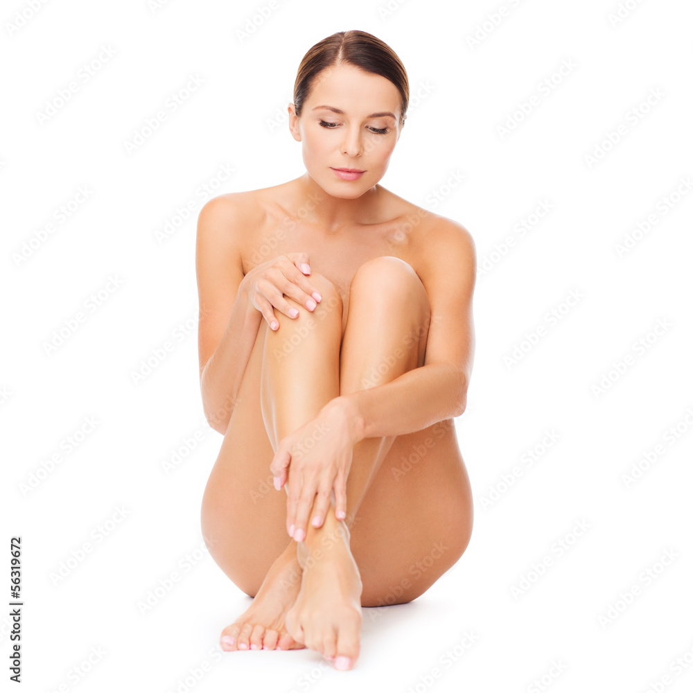 Obraz premium beautiful naked woman touching her legs