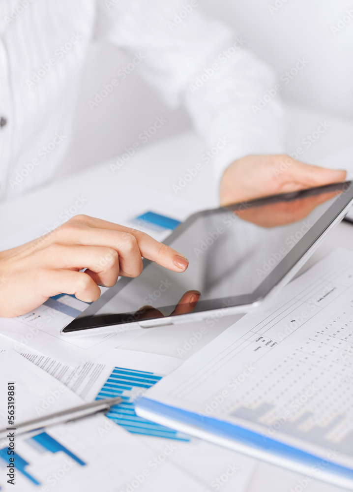 woman with tablet pc and chart papers woman with tablet pc and chart papers