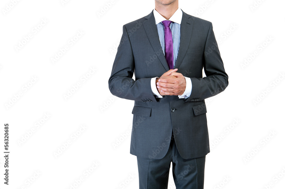 businessman correcting a tie on black background businessman correcting a tie on black background