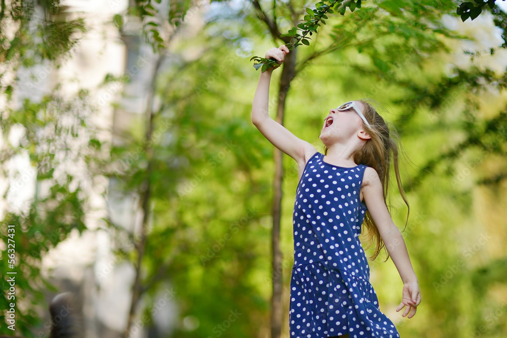 Adorable girl having fun outdoors Adorable girl having fun outdoors