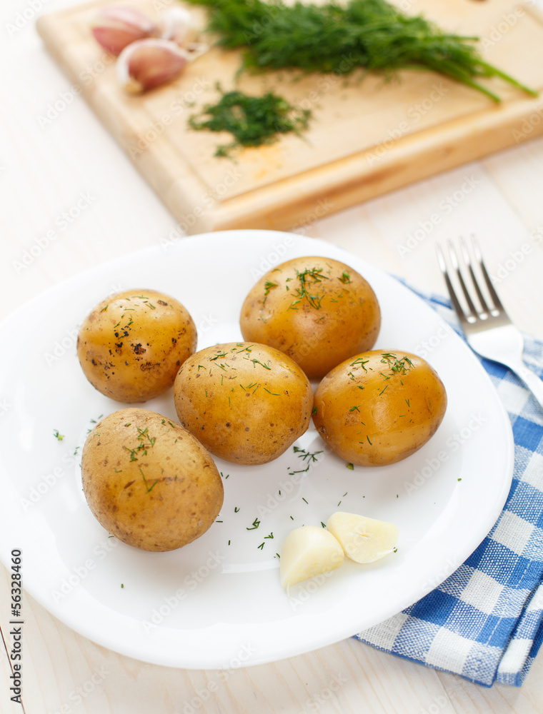 Young boiled potatoes with dill