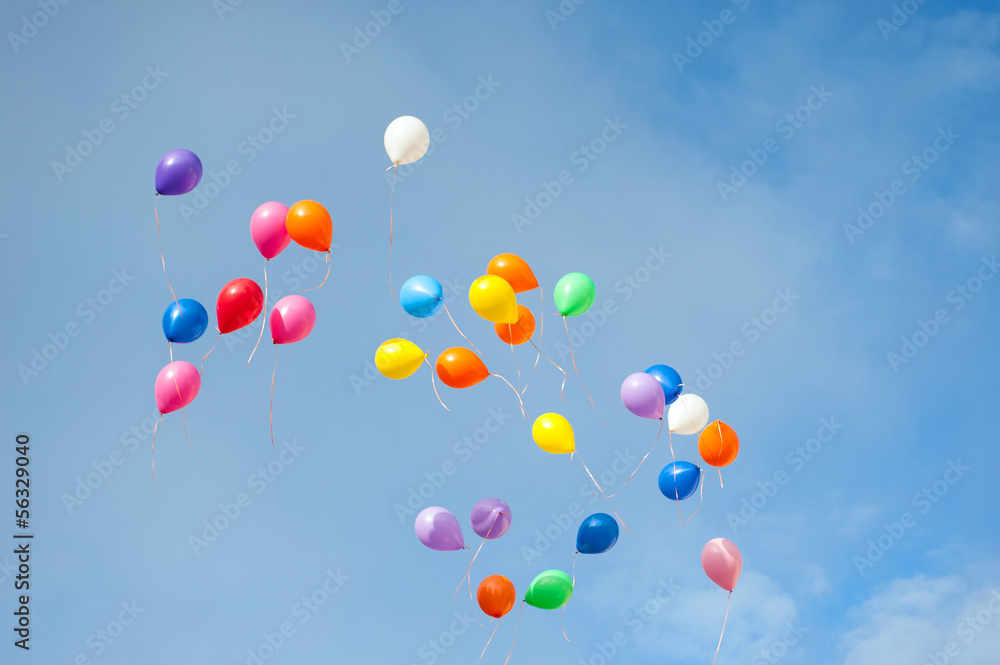 multicolored balloons in the blue sky