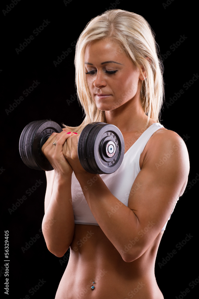 Young sexy woman dumbbells exercises