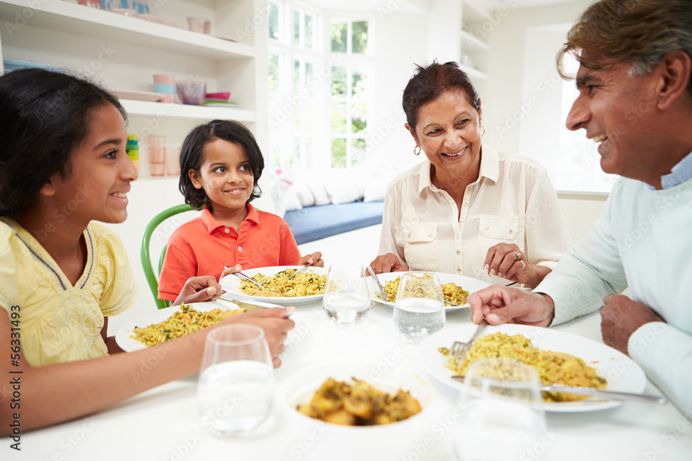 Indian Grandparents And Grandchildren Eating Meal At Home Indian Grandparents And Grandchildren Eating Meal At Home