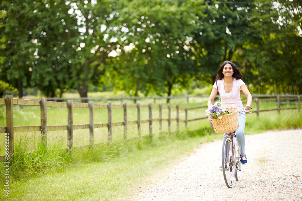 Indian Woman On Cycle Ride In Countryside Indian Woman On Cycle Ride In Countryside