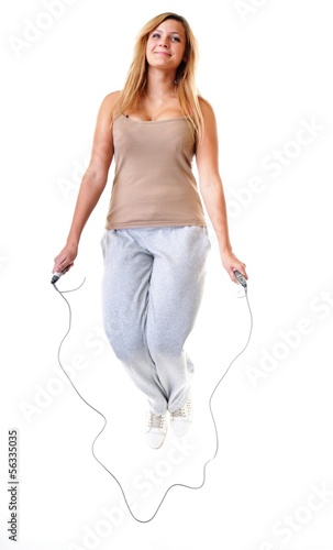 young fitness woman with jump rope isolated