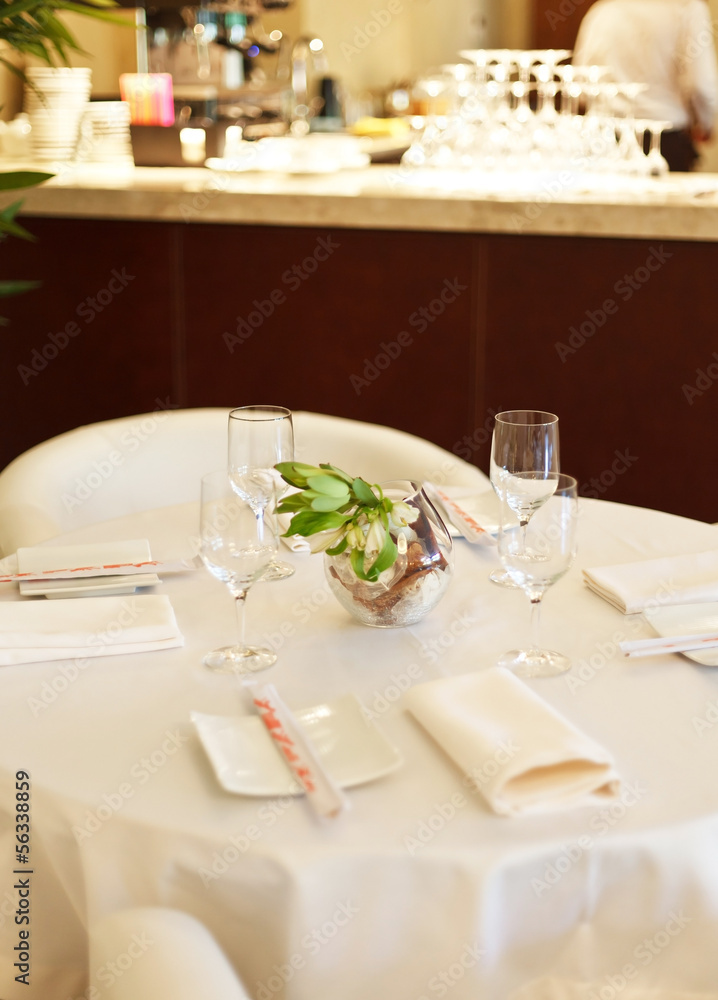 Tables set for meal Tables set for meal