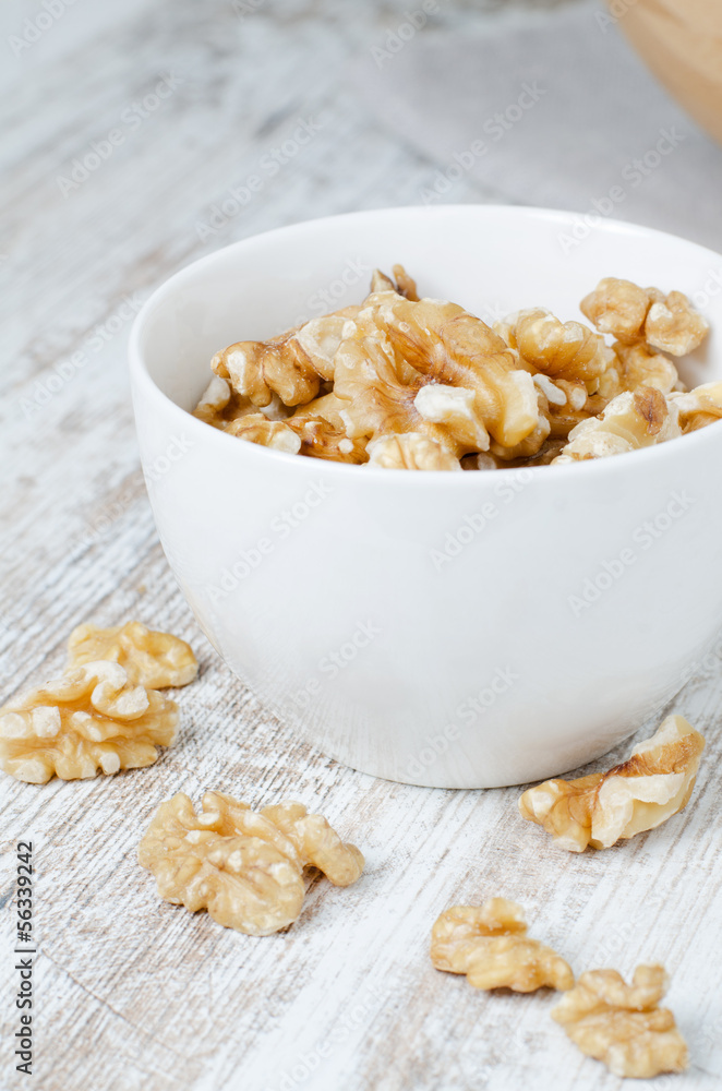 Walnuts in a white cup