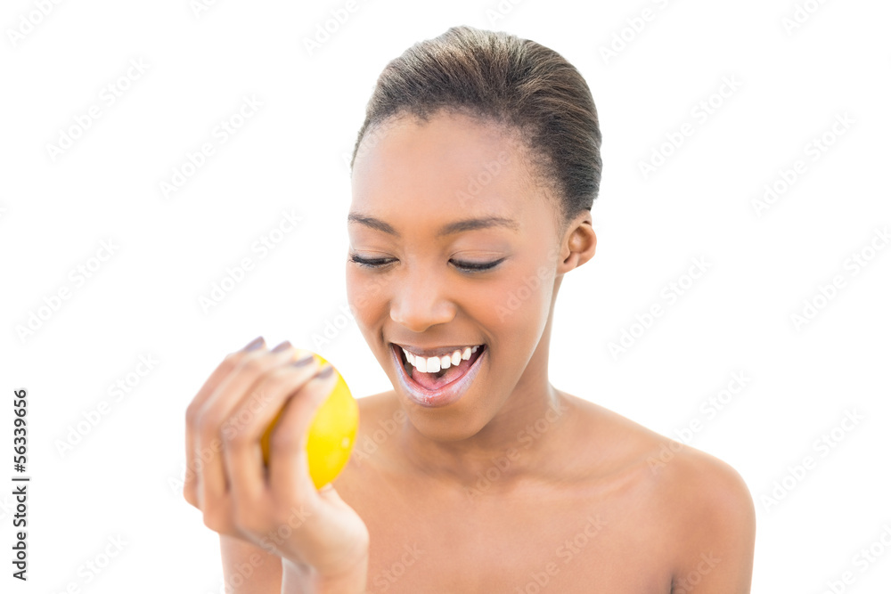 Cheerful natural model holding orange Cheerful natural model holding orange
