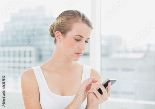 Free Download Focused blond woman text messaging - GFXLoad